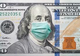 Image of Benjamin Franklin on a $20 bill with a face mask